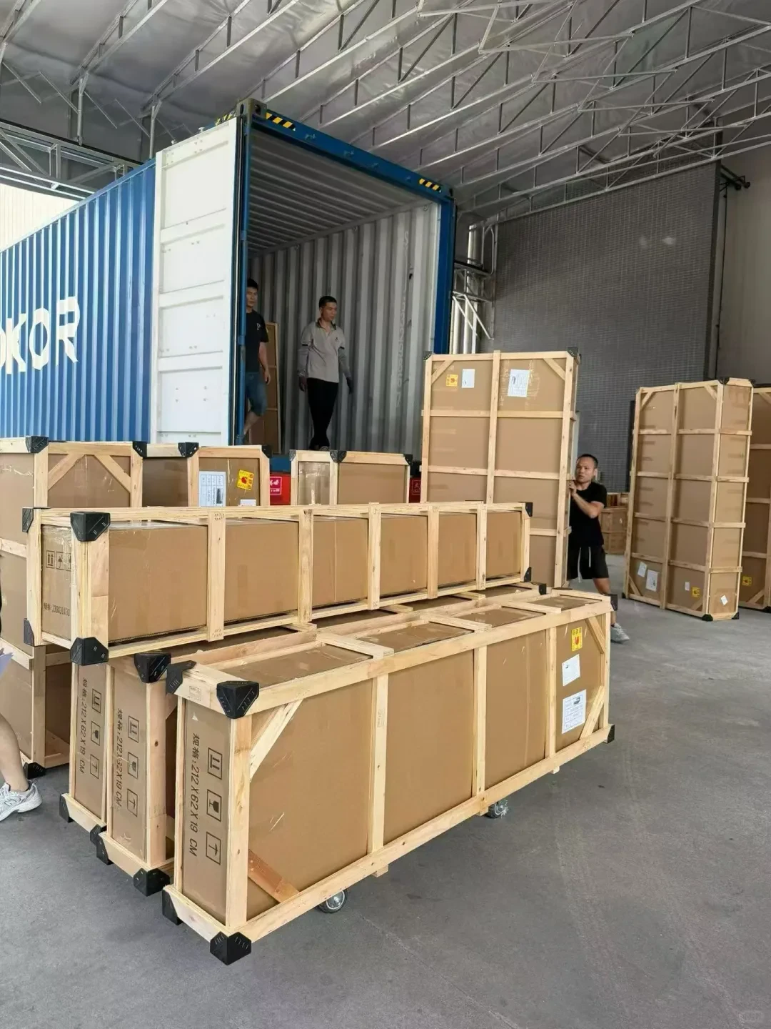 Timber-framed cartons prepared for loading into a shipping container