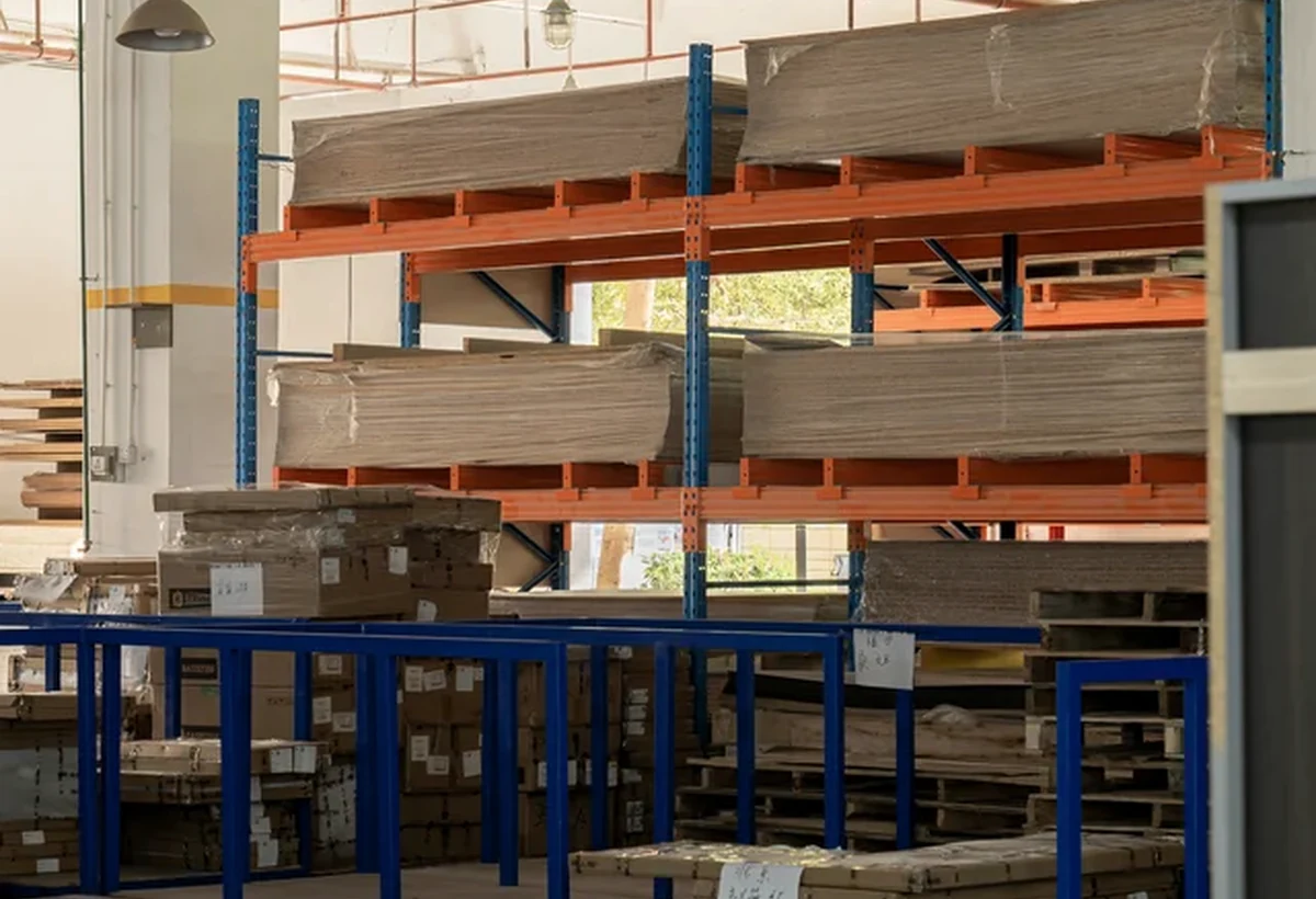 Stacks of sheet material stored by type in a cabinetry factory