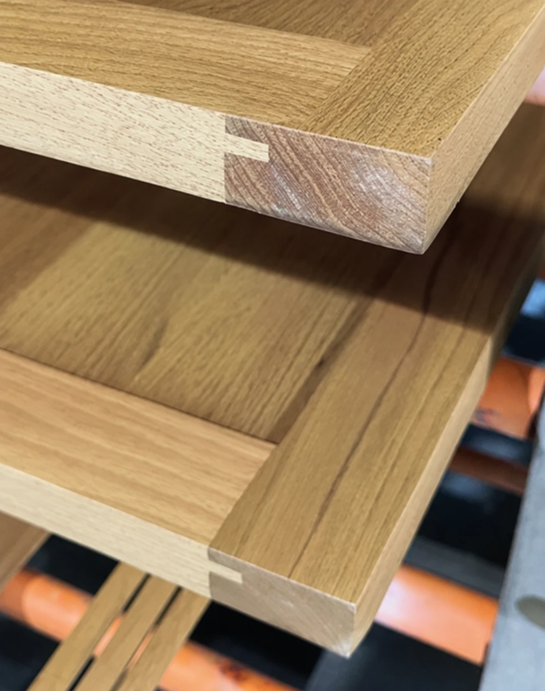 Close view of a solid timber cabinet door edge and corner joint