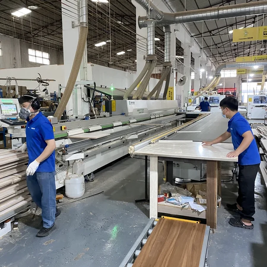Cabinet panels moving through a factory processing line