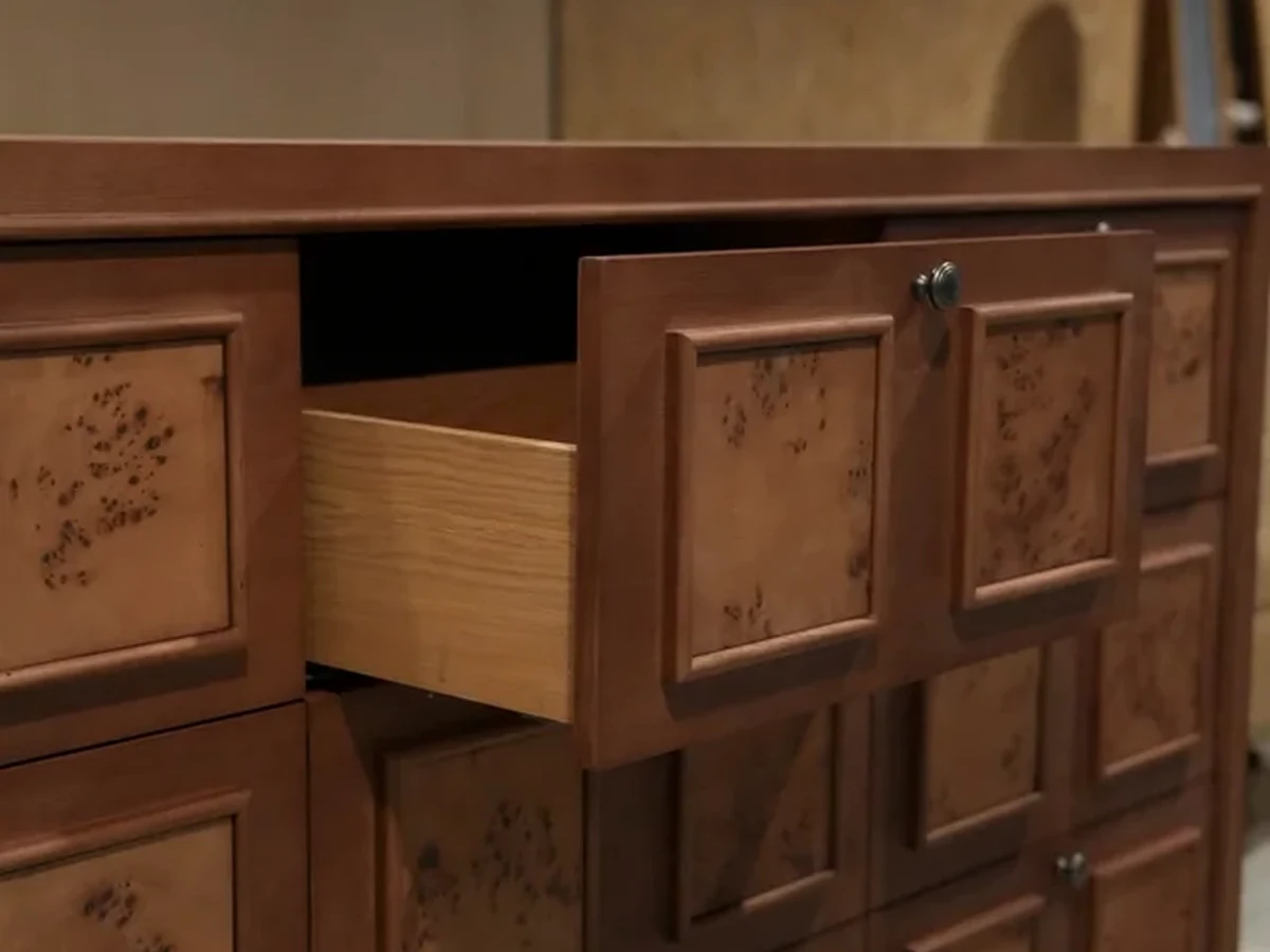 Open timber drawer showing the door face, edge, handle and internal finish