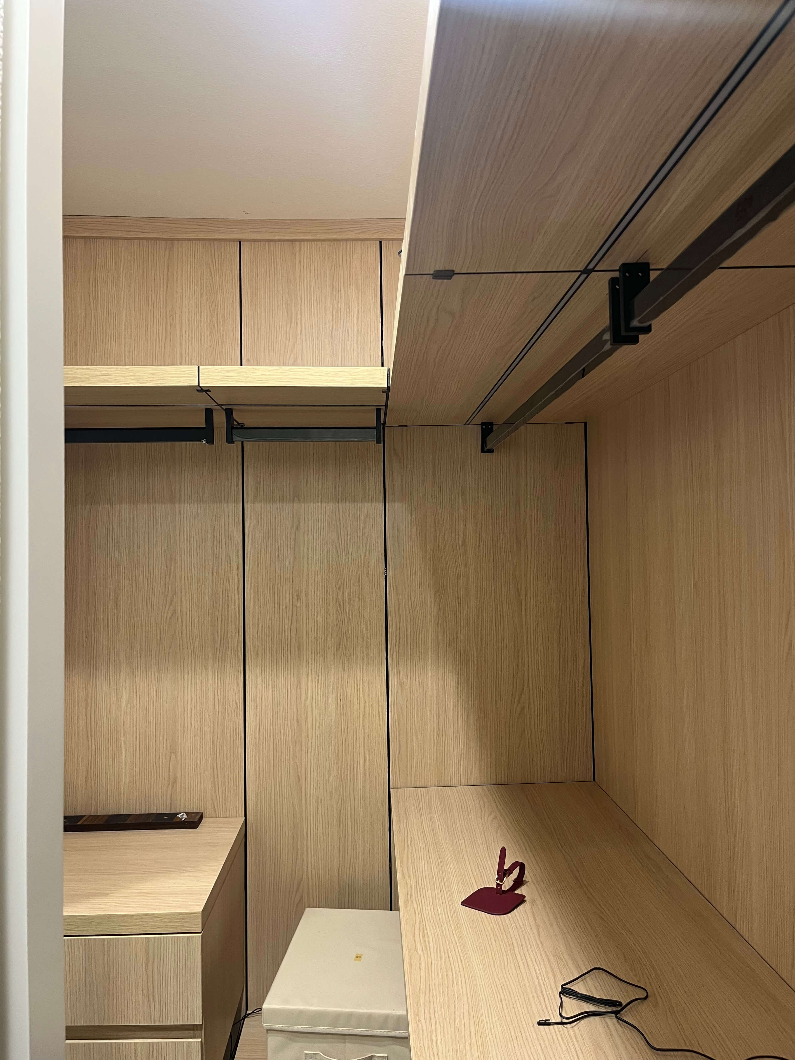 Completed Arcaya wardrobe project with open storage and integrated lighting