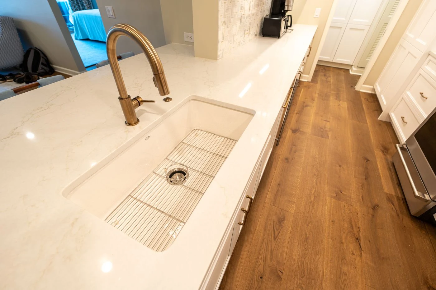 Finished light stone countertop showing its surface pattern, edge and undermount sink opening