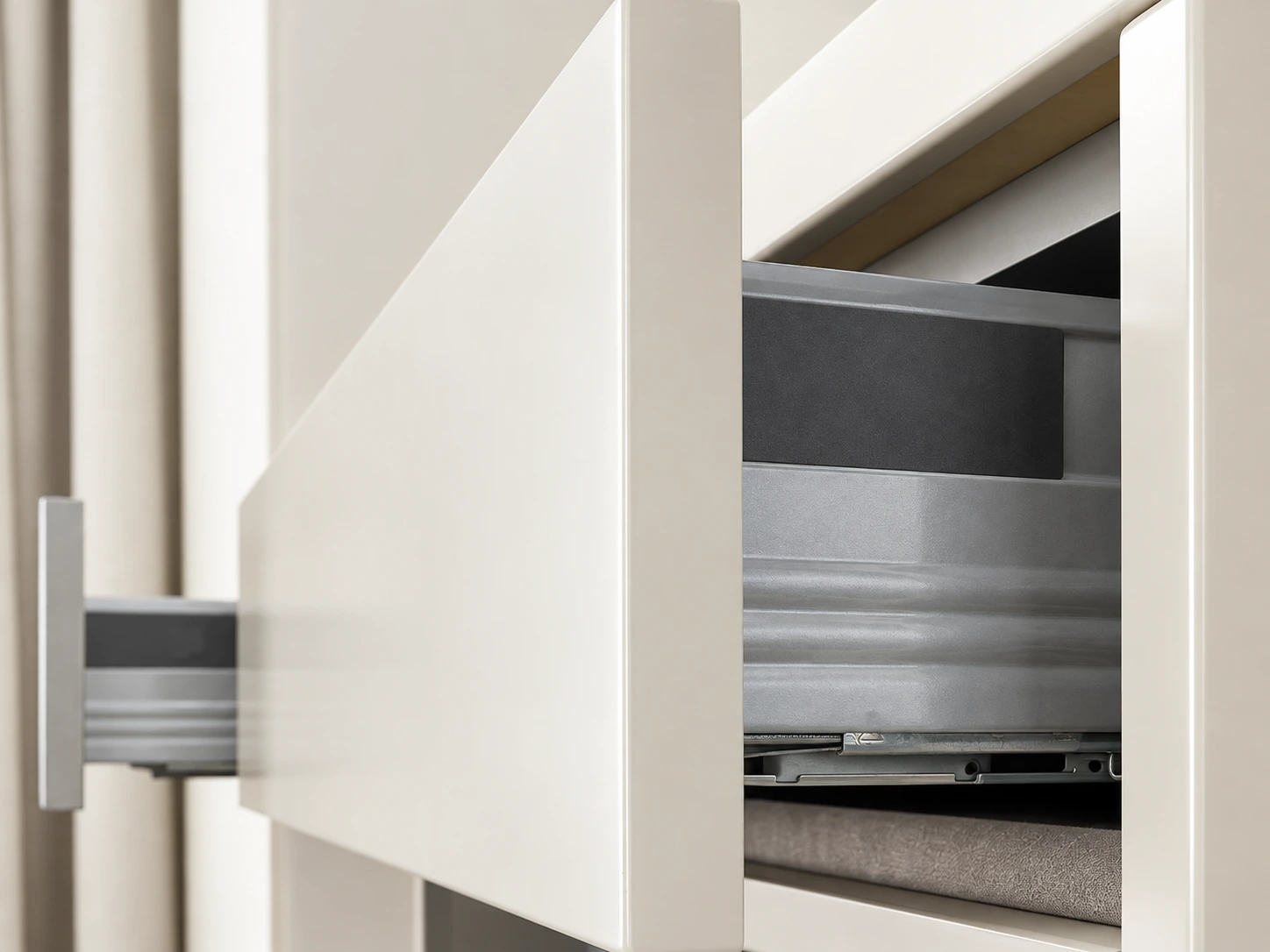 Close-up of a clean flat white drawer front with a simple edge detail