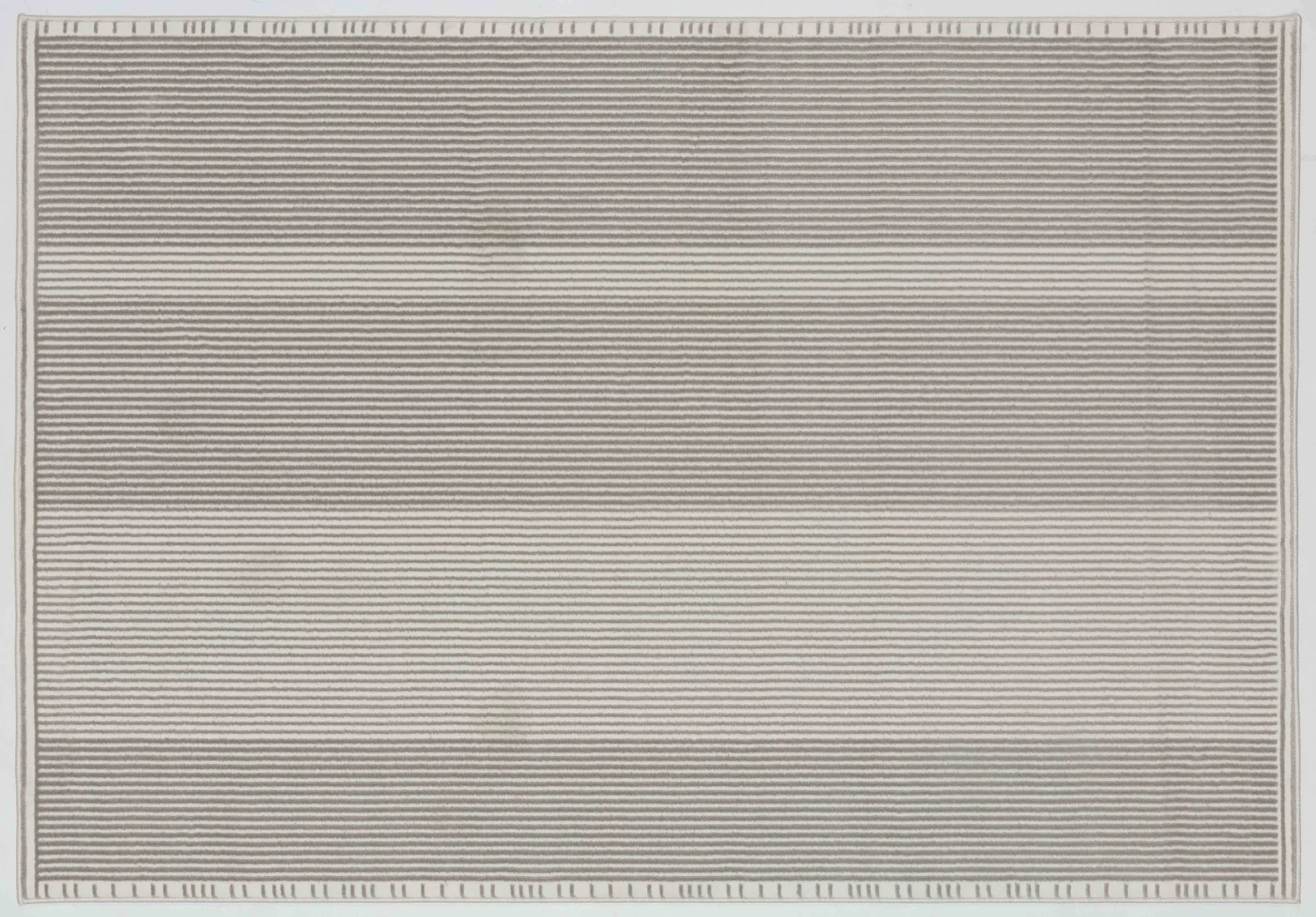 Whisper Dawn Area Rug in a finished interior.