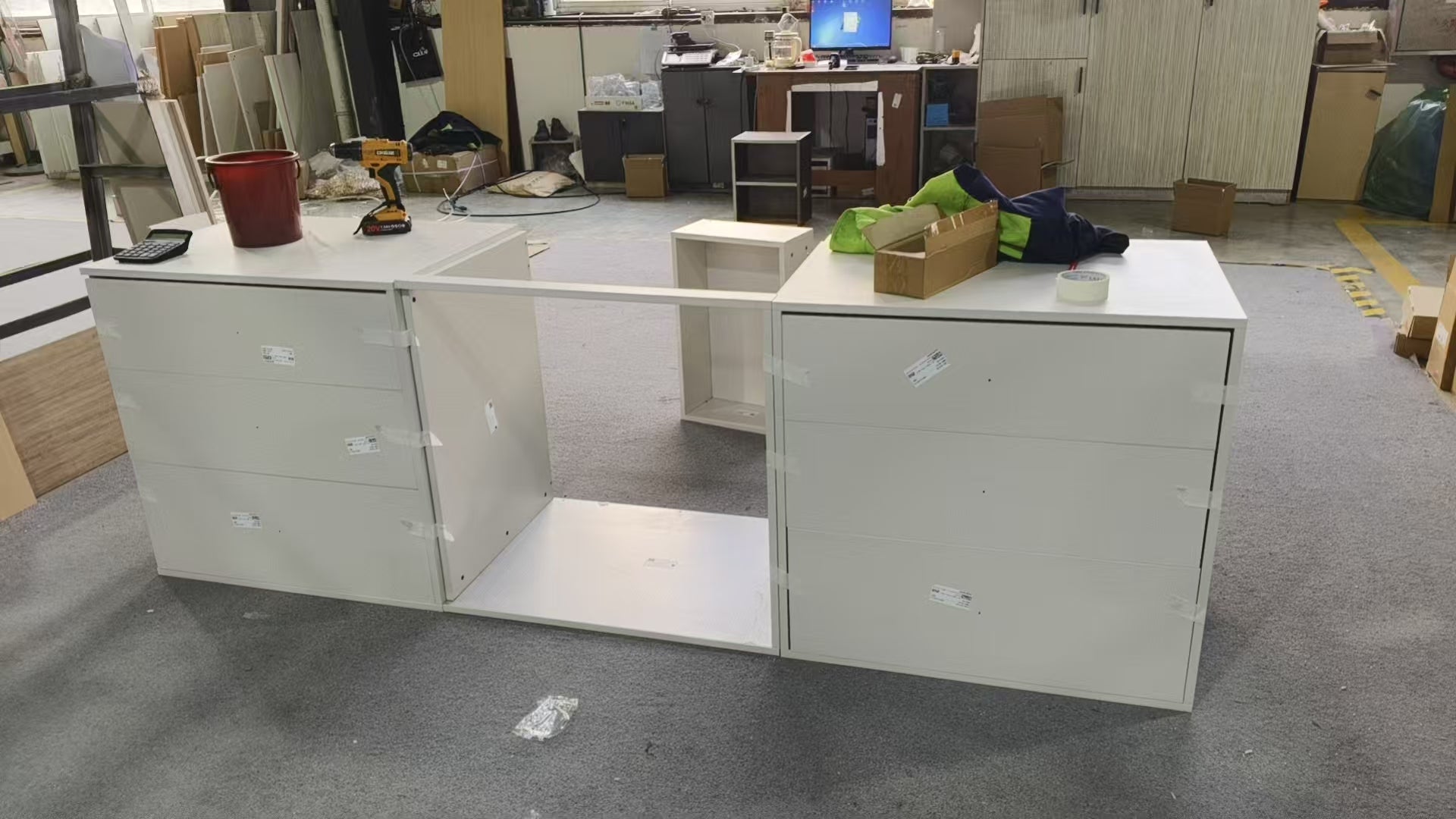 Cream lacquer sink run assembled with the sink and dishwasher openings pre-cut