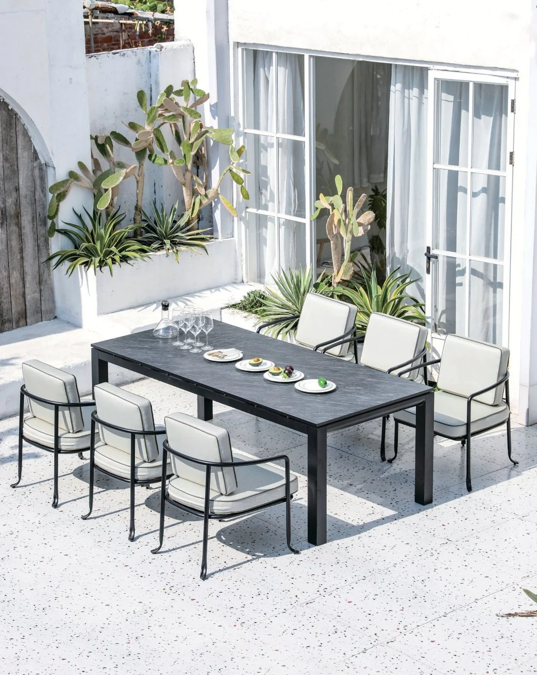 Black outdoor table with eight chairs