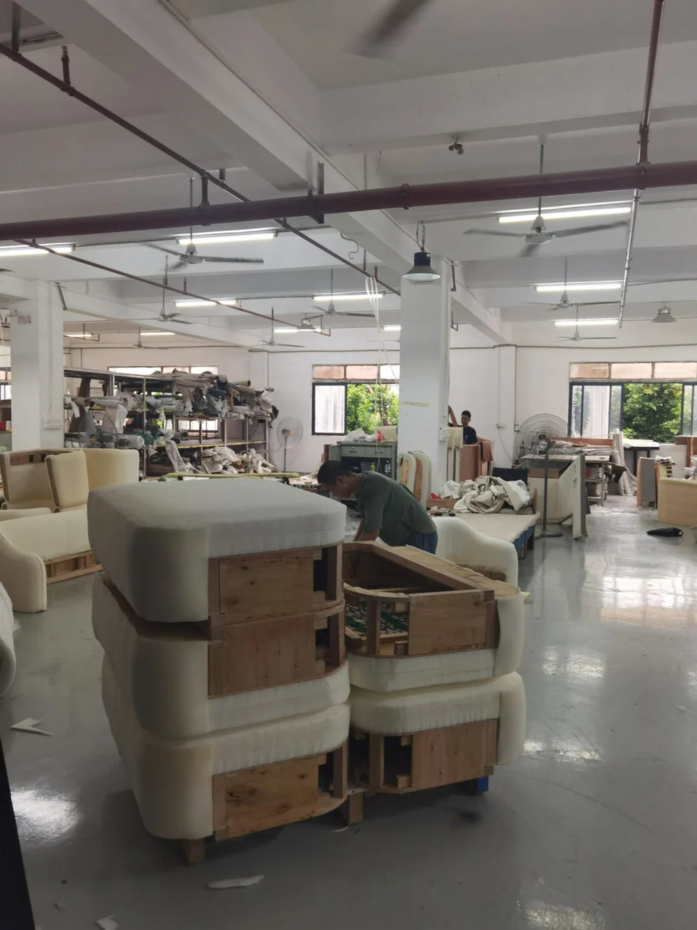 Upholstered seating protected with wrapping and timber supports