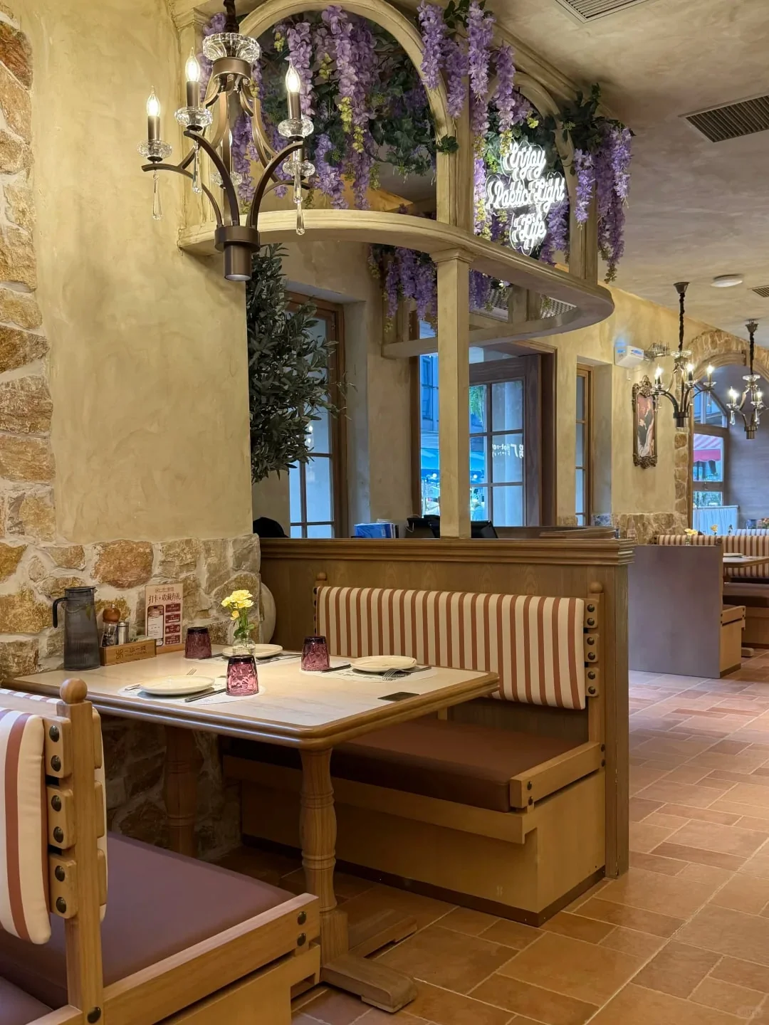Striped restaurant booth with a visible timber base and dining table