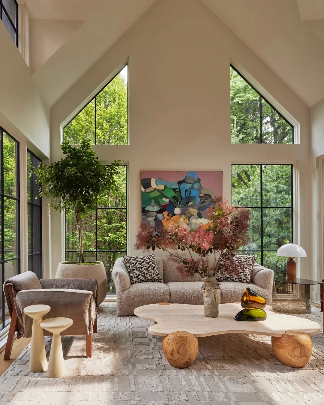 A tall window wall gives the room immediate calm and scale.
