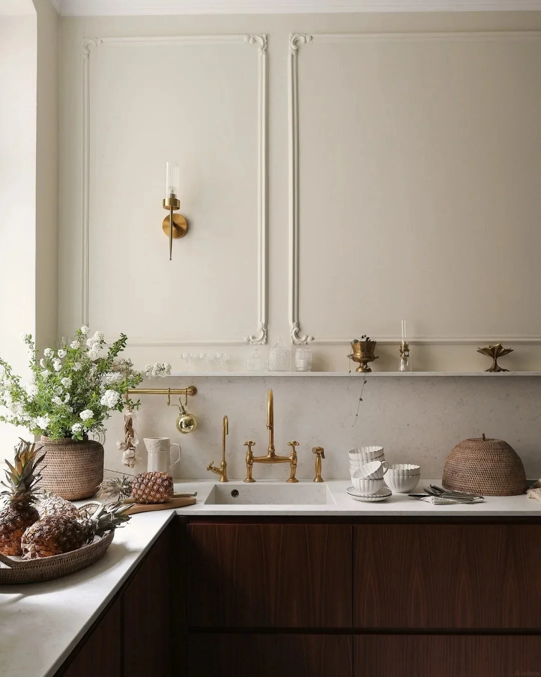 Warm wood and brass can make traditional details feel current