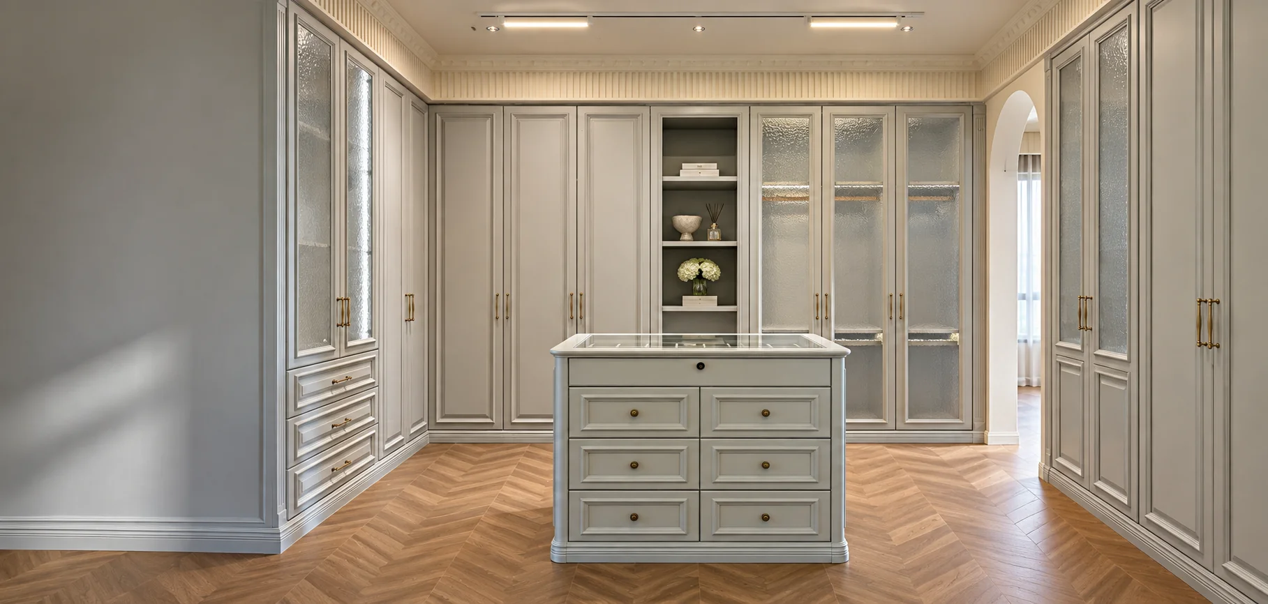 Custom walk-in closet with fitted wardrobes and illuminated storage