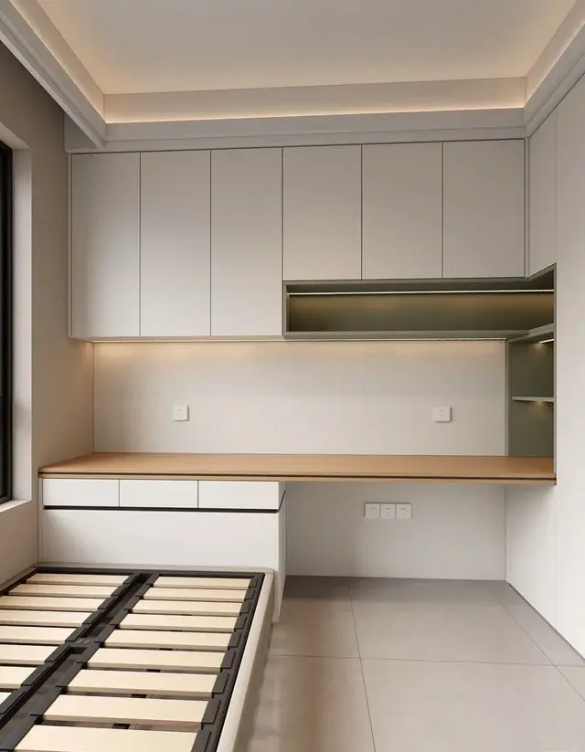 Compact bedroom layout with a bed frame, wardrobes, outlets, and desk area