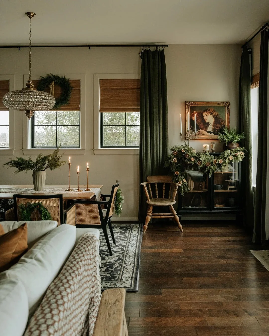 A sofa behind the main seating keeps an open room visually connected.