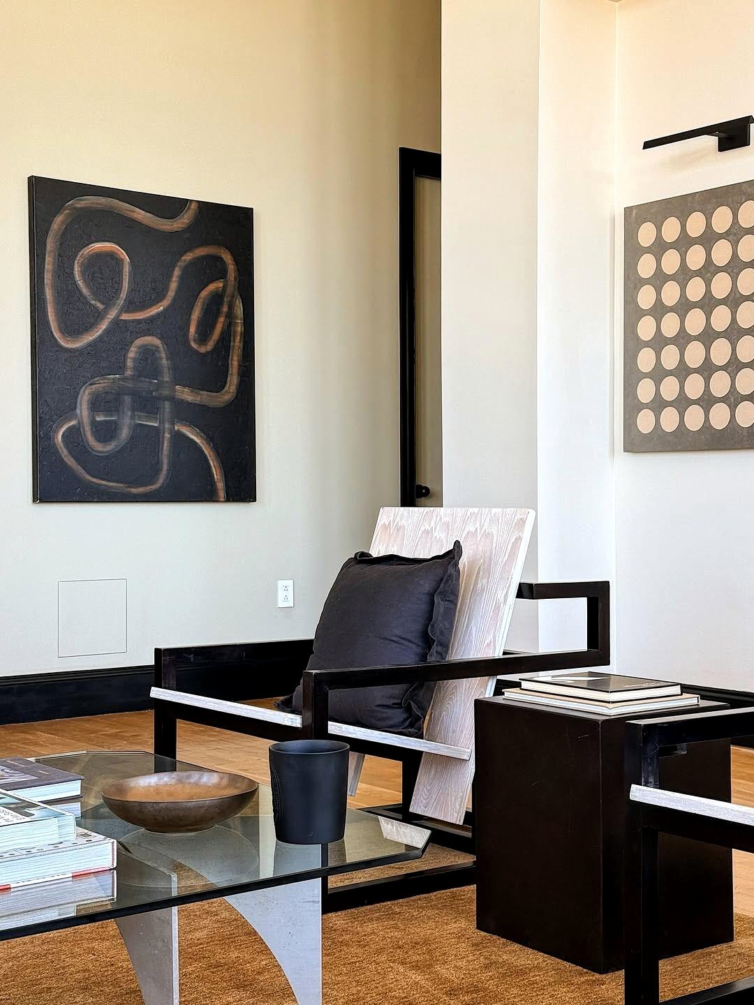 Modern art and lounge chair in a city apartment